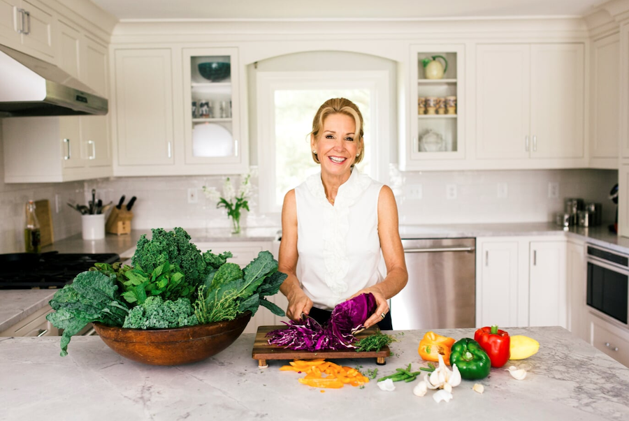 Dr. Ann in her kitchen with healthy foods